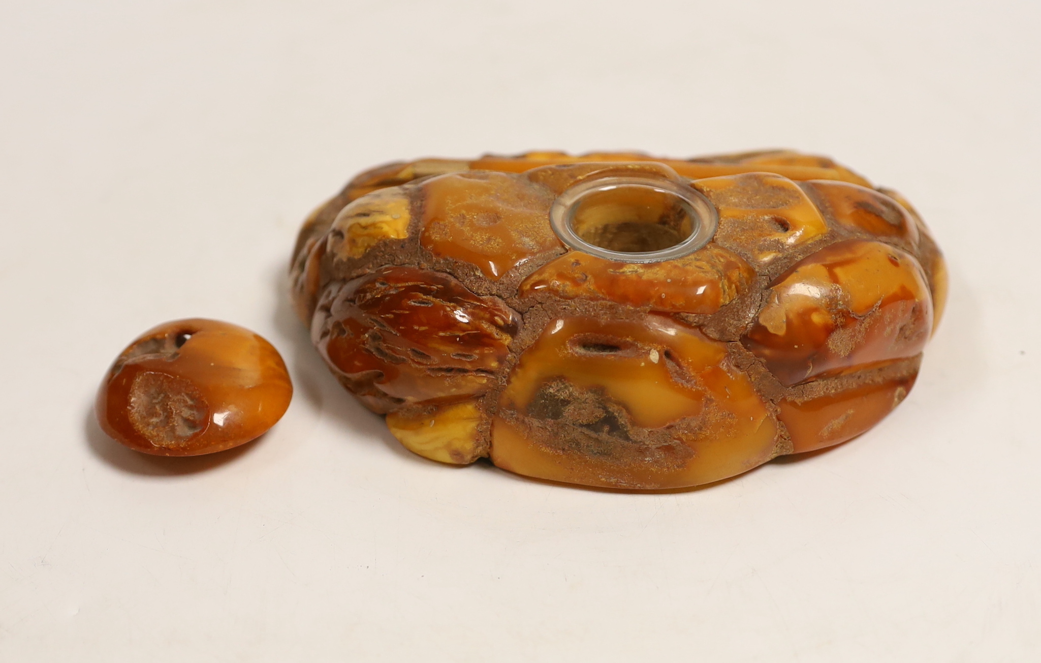A carved amber inkstand, 15.5cm wide